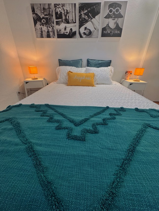Beach House bedroom with framed artwork above the bed