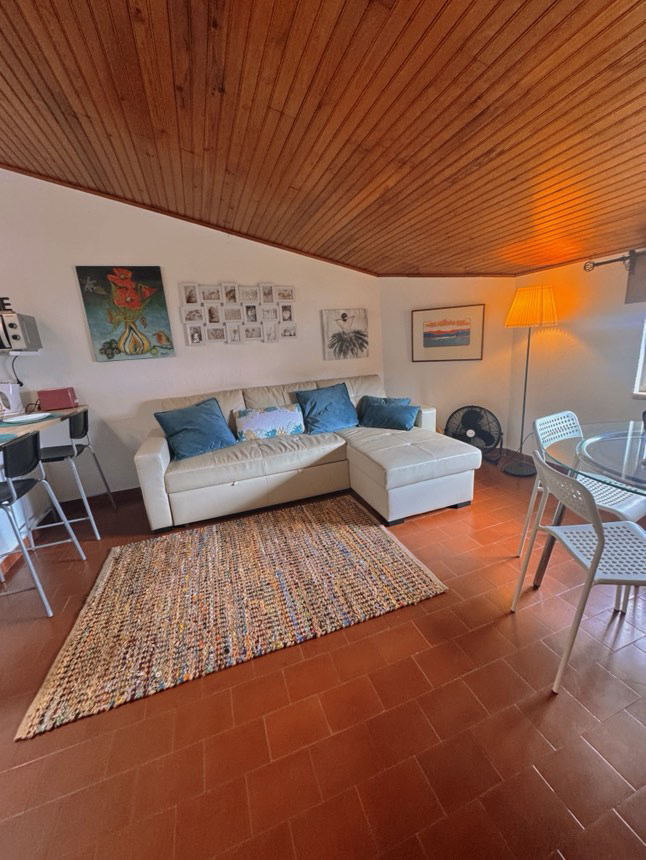 Living and dining room at Aroeira Retreat